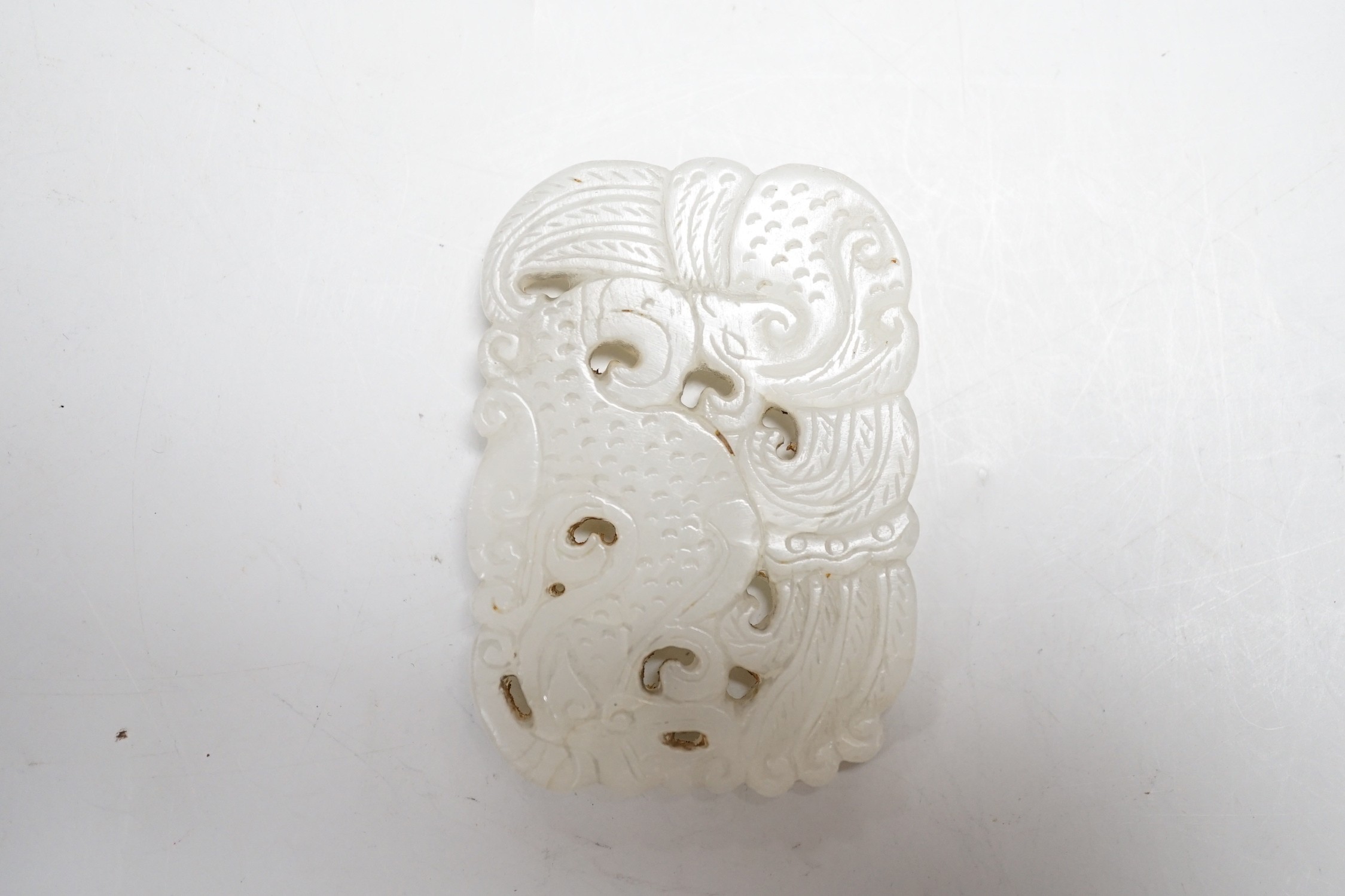 A Chinese white jade plaque, 19th / 20th century, 6 x 4cm